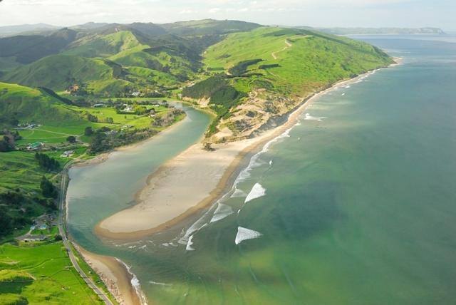 The rivermouth banking sand out onto the shelf, from above, Ākitio surf spot, Wellington / Wairarapa, New Zealand.