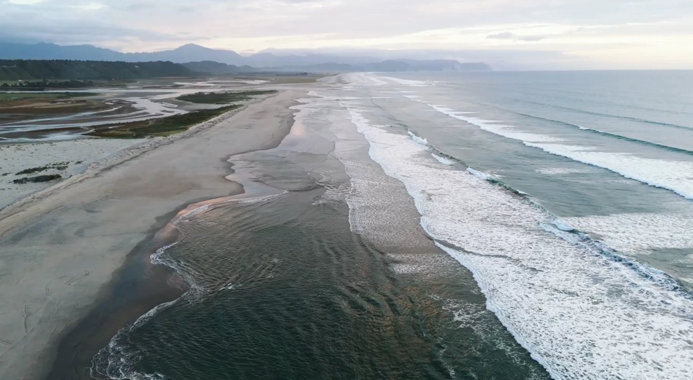 Surfing at Karamea, Karamea surf spot, West Coast South Island, New Zealand.