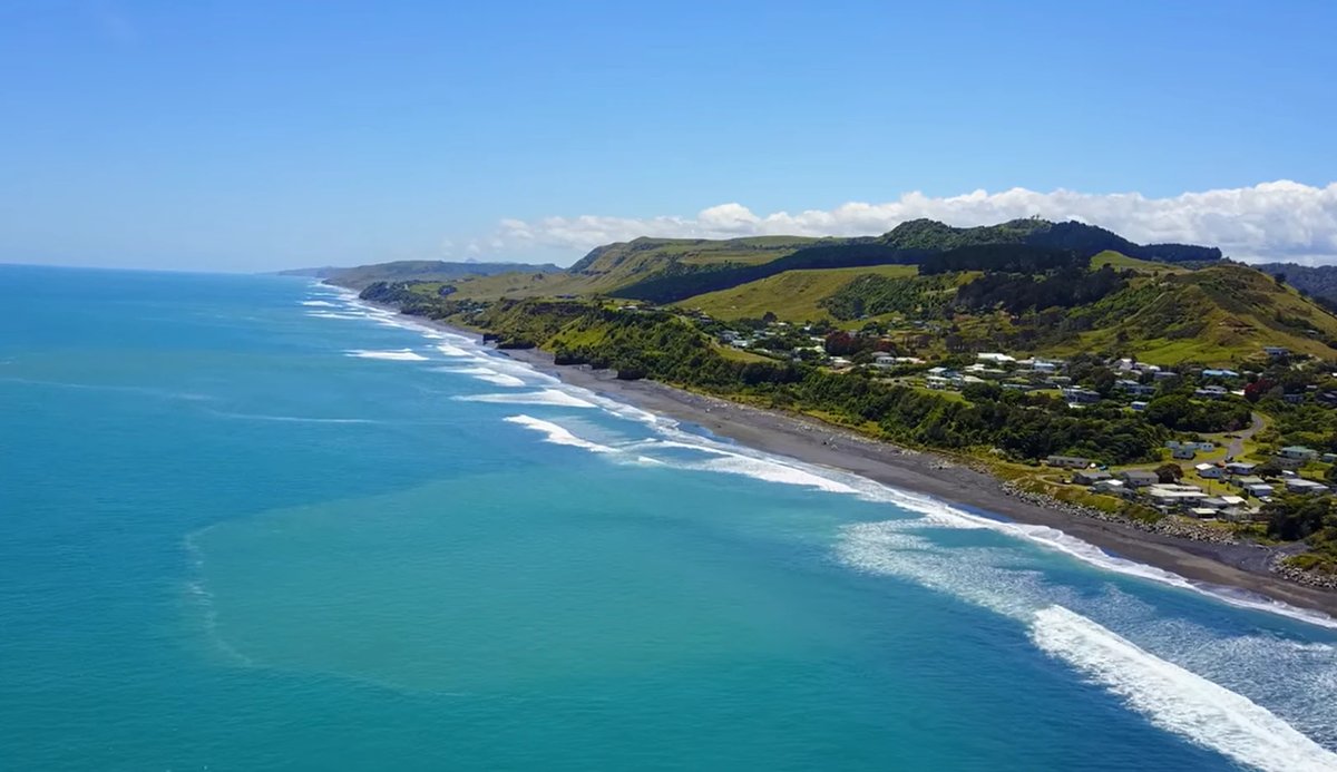 The settlement strung along the beach, an easy check as you pass on the long drive north, Mōkau surf spot, Taranaki / SH45, N