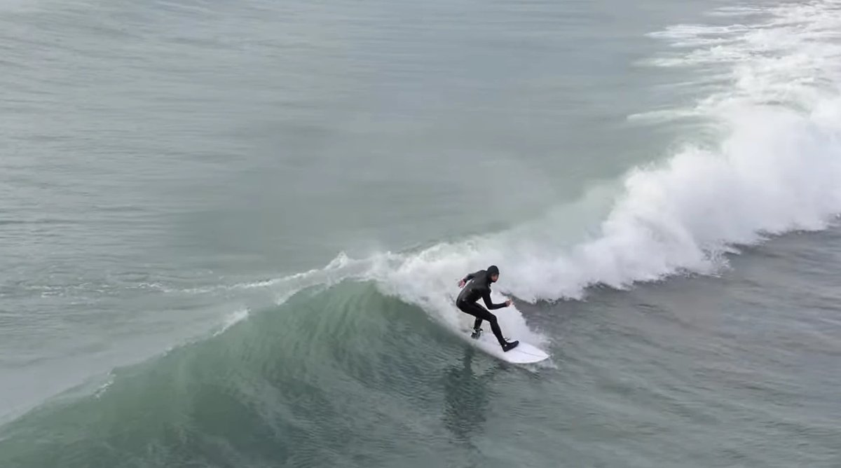 Leaning into a clean little wall on a cold, glassy Canterbury morning, New Brighton surf spot, Canterbury, New Zealand.