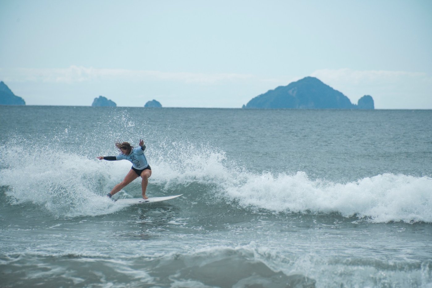 Clean turn on a small Pauanui wave with the Aldermen Islands offshore. The friendly side of the east Coromandel, Pauanui surf