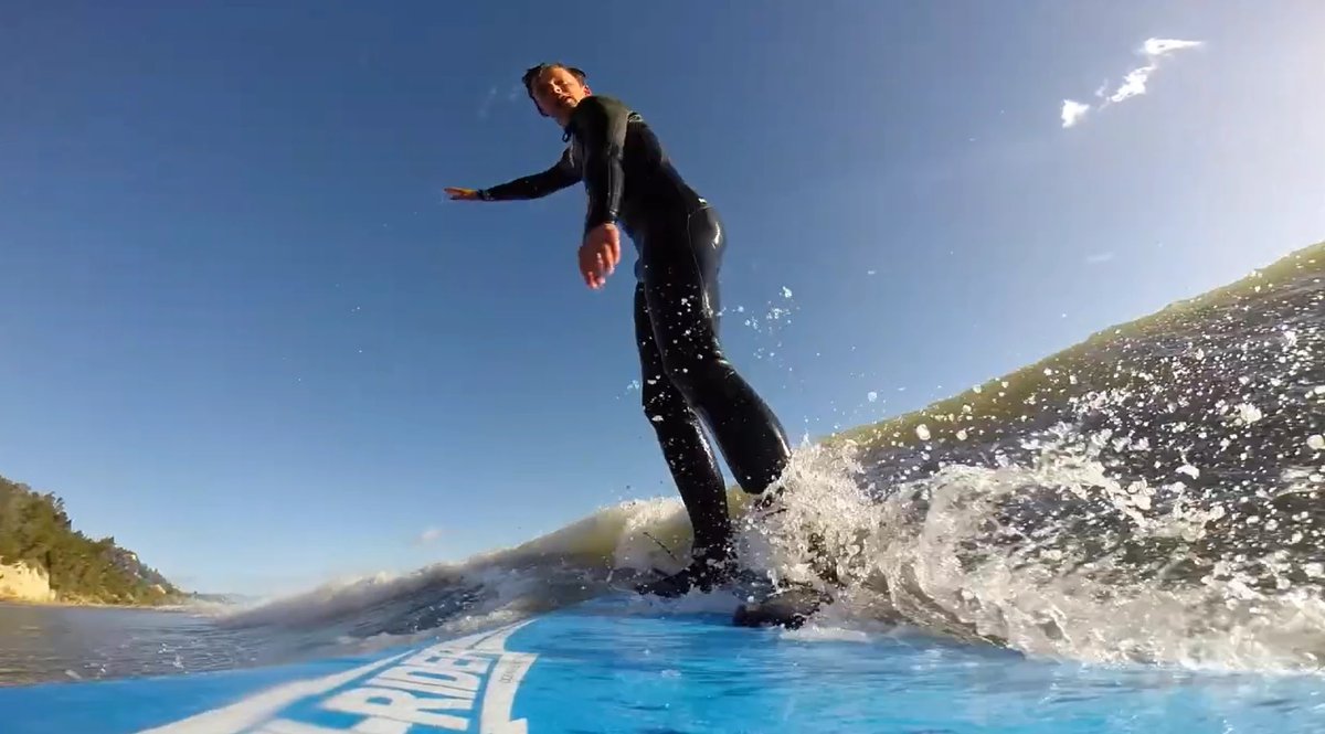 Toes towards the nose under blue sky, the long forgiving wall Ruby Bay is loved for, Ruby Bay surf spot, Marlborough / Nelson