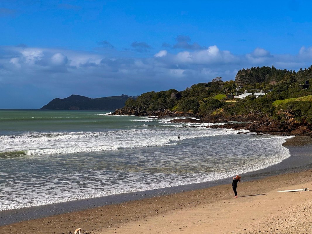 Quiet afternoon at the south end, Waipū Cove surf spot, Northland East, New Zealand.