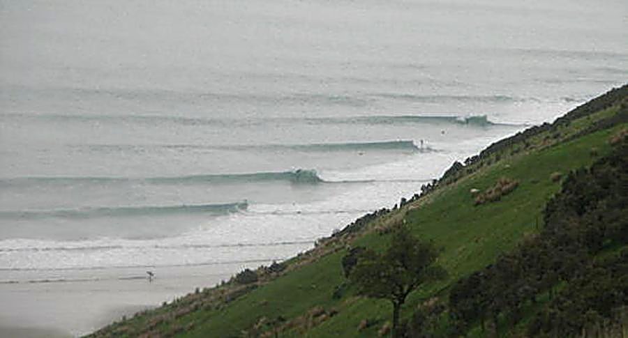 Groomed lines feather down the point on a still, misty morning, rarely a crowd to share them with, Whareakeake / Murdering Ba